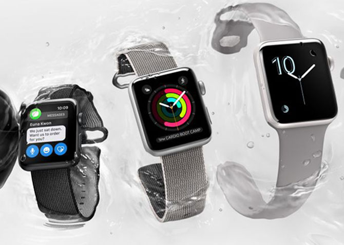 Apple watches floating in water showing varying screens